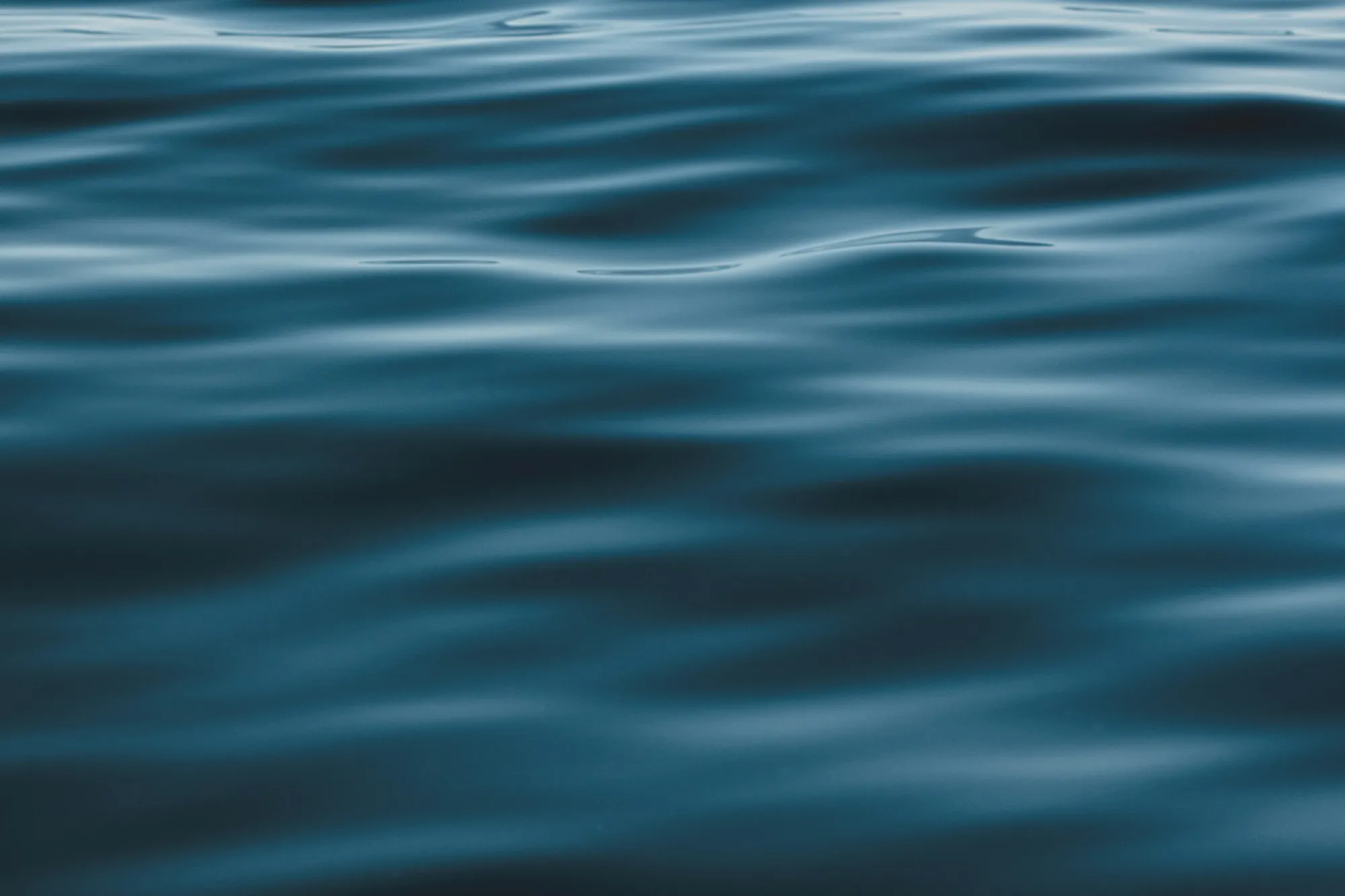 Calm surface of deep blue water